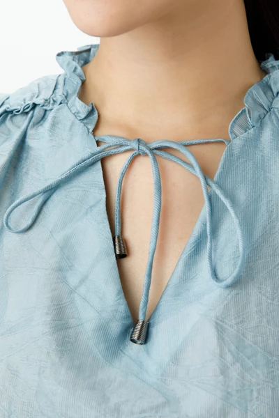 Áo tencel dập nổi nhấn bèo